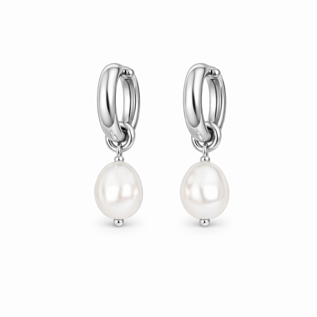 Pair of silver hoop earrings with white pearls on a white background

