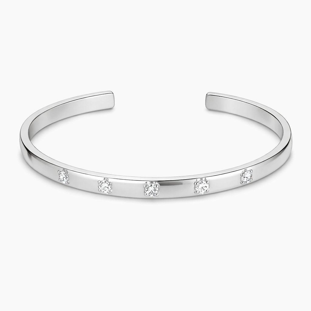 Silver bracelet with small diamonds on a white background

