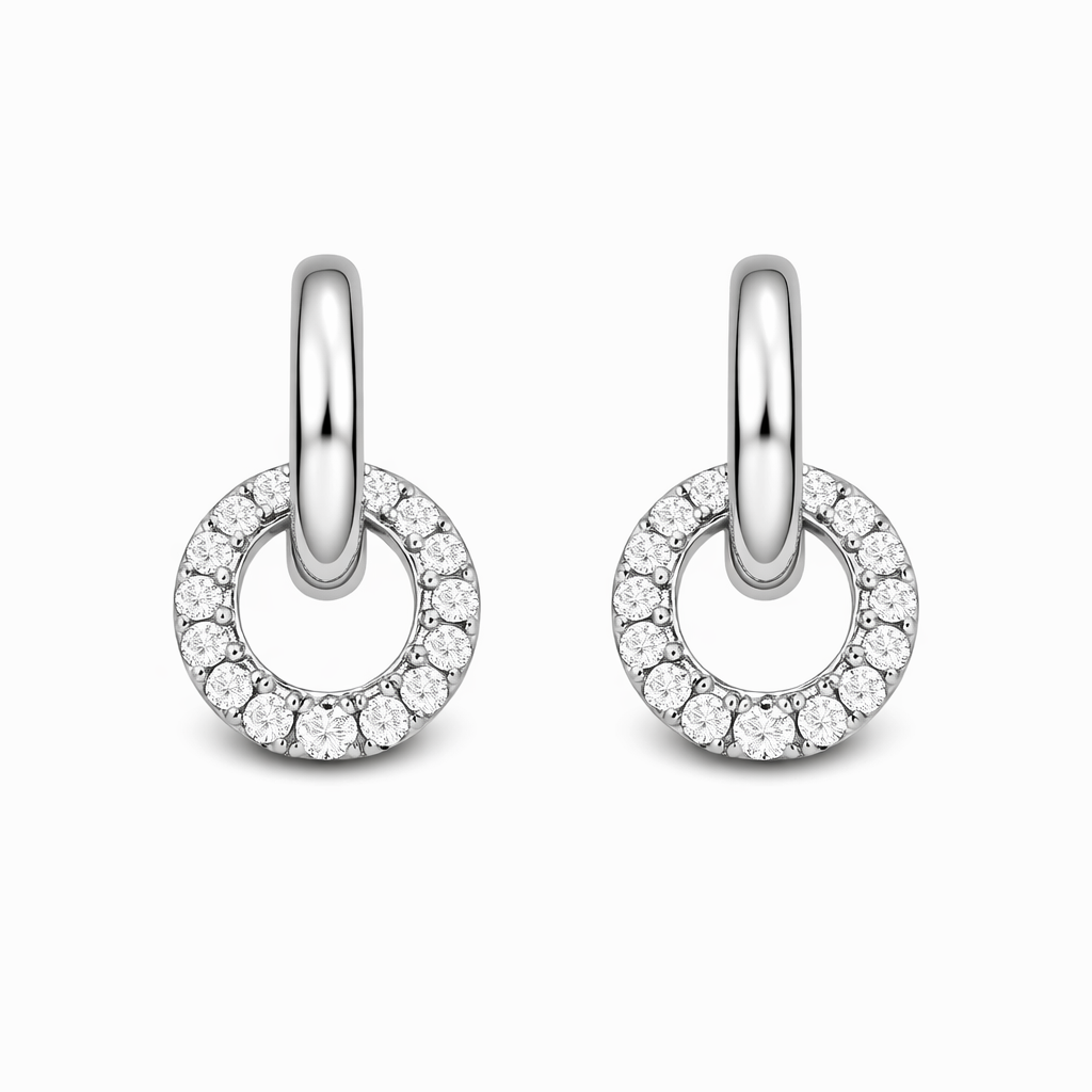 Pair of silver hoop earrings with clear gemstones on a white background

