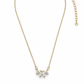 Gold necklace with a floral pendant on a white background

