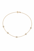 Gold necklace with small pendants on a white background

