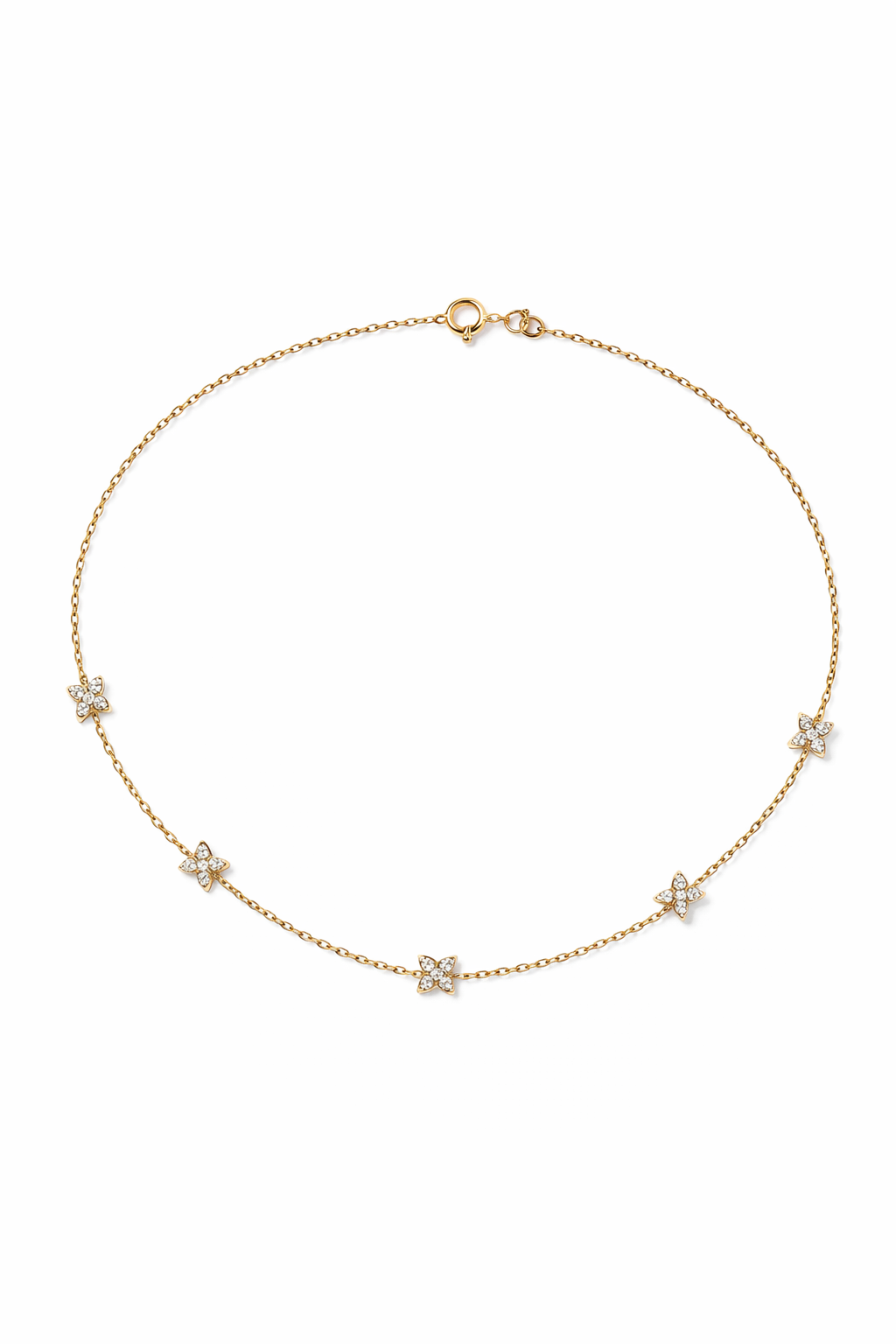 Gold necklace with small pendants on a white background

