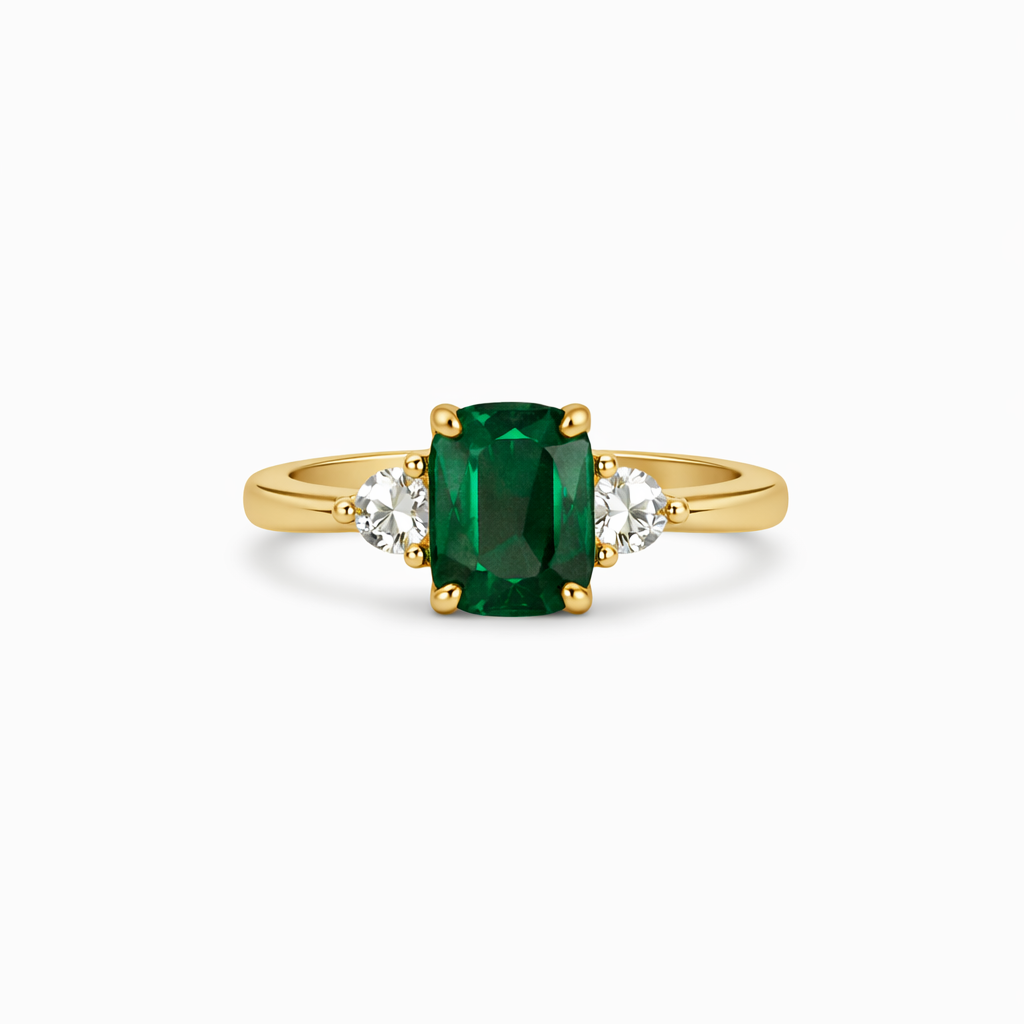 Gold ring with a green gemstone and smaller diamonds on a white background.