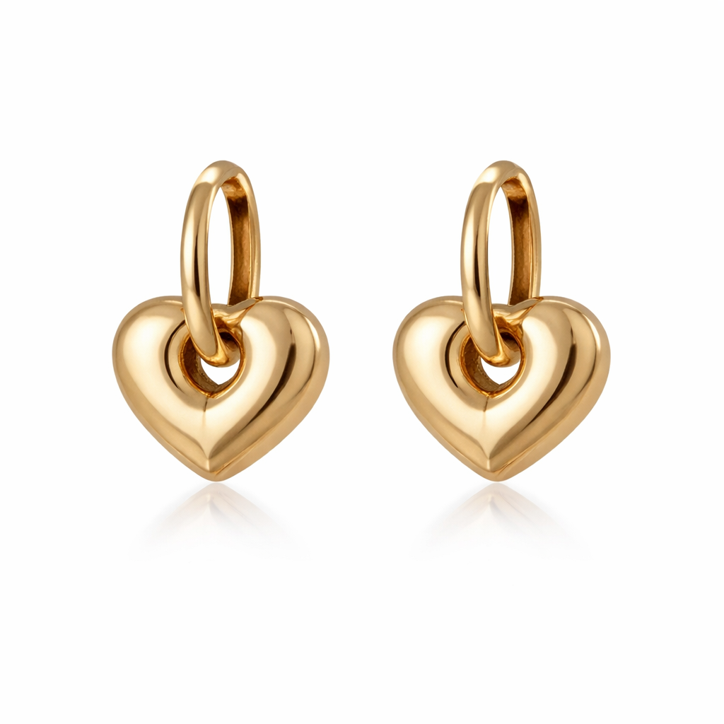 Gold heart-shaped earrings on a white background

