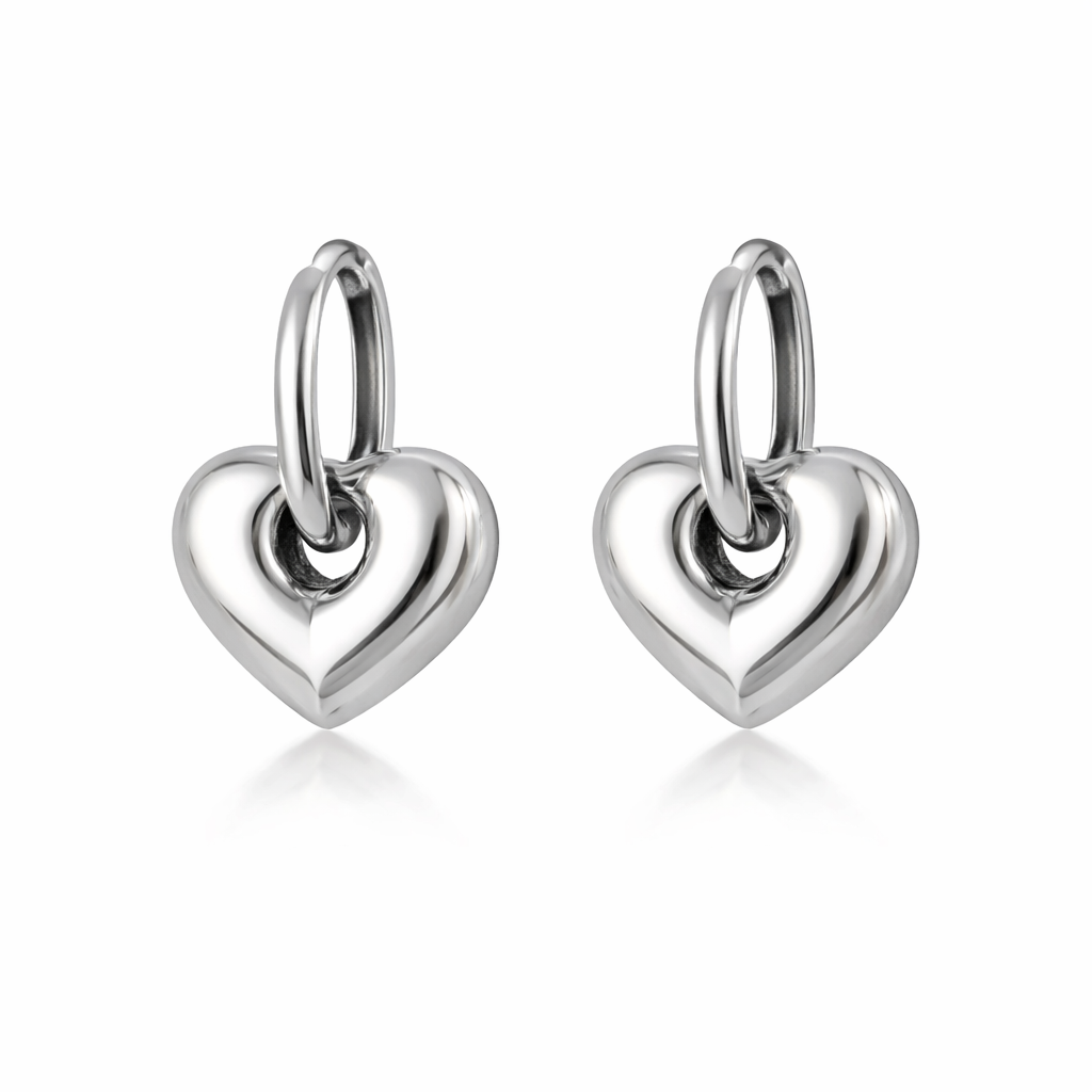 Pair of silver heart-shaped earrings on a white background

